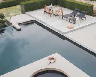 Outdoor Wishbone Chair featuring Elaine Dining Table in Black Marble Outdoor Wishbone Chair featuring Elaine Dining Table in Black Marble